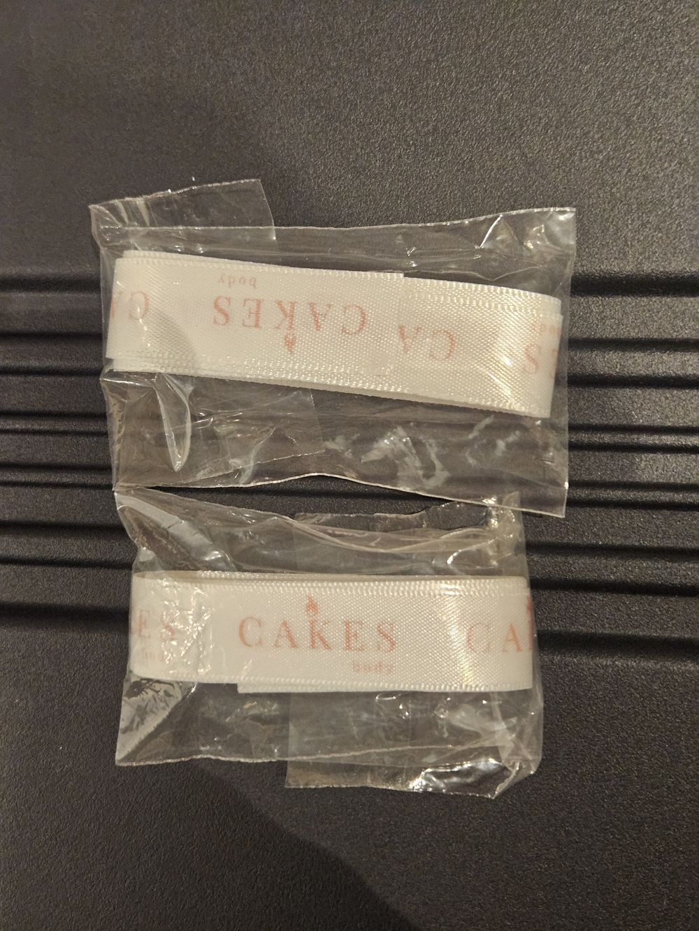 Cakes Body White Satin Ribbon with Pale Pink 'CAKES' Print NWOT